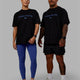 Duo wearing Unisex 1% Better FLXCotton Tee Oversize - Black-Power Cobalt
