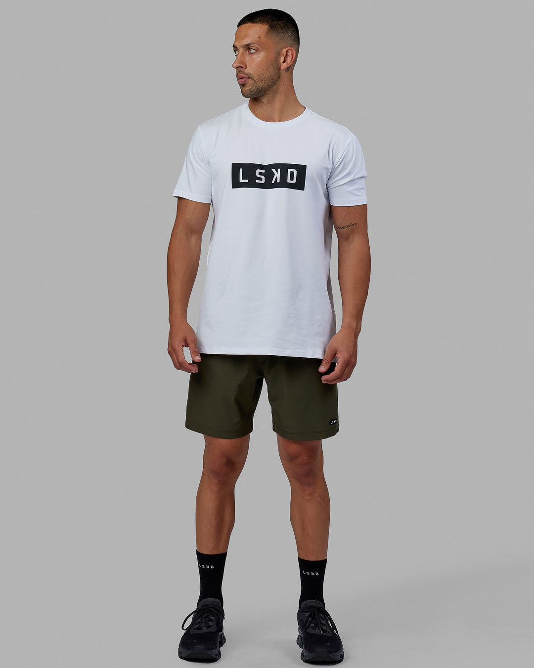 Man wearing Rep 7'' Performance Short - Forest Night
