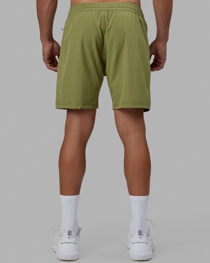 Man wearing Rep 7'' Performance Short - Moss Stone-Lime
